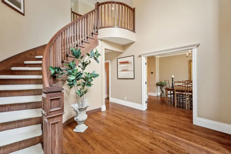 Grand entrance, with spiral staircase, wood spindles. Oak Hardwood flooring.