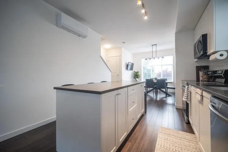 Open concept kitchen and dining room. Kitchen upgrade: accent lighting.