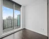 Bedroom with balcony access.